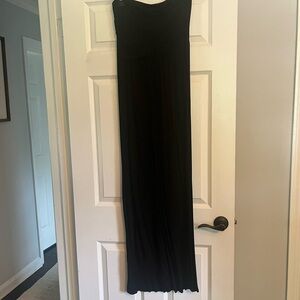 Black strapless maxi dress with pockets.